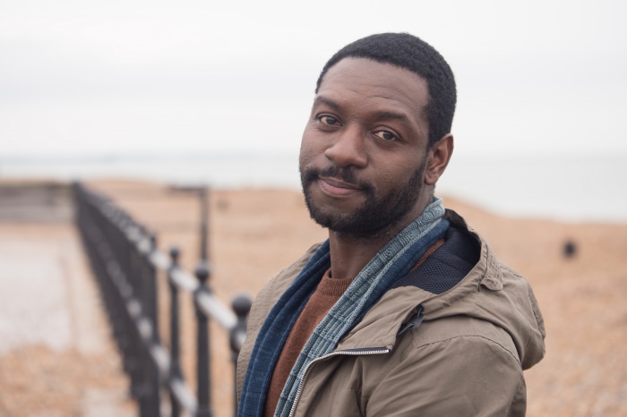 Richie Campbell on a beach