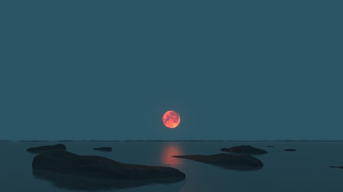 Red Moon over the Ocean at Night