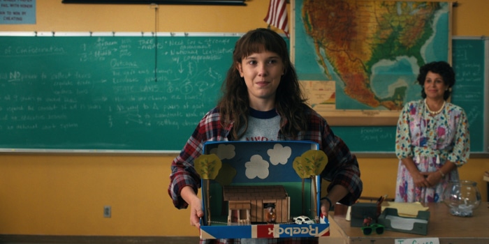Eleven from Stranger Things in a classroom