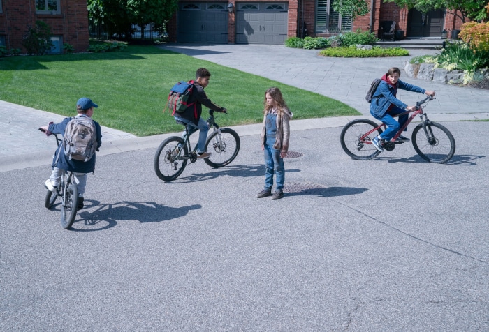 Children on bicycles in a suburban street