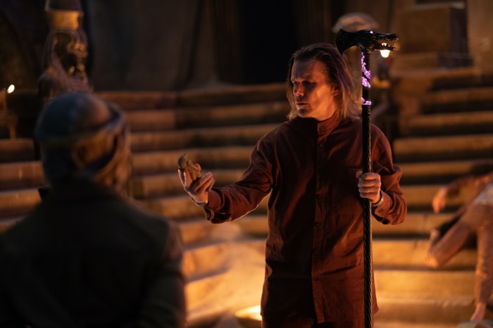 Arthur Harrow from Moon Knight holding an artifact