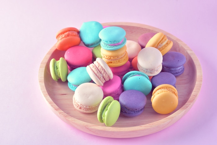 Colorful Macarons on a Wooden Plate