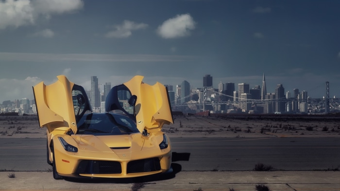 Yellow Ferrari LaFerrari with San Francisco skyline
