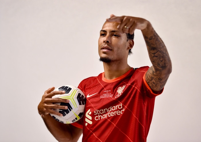 Virgil Van Dijk of Liverpool F.C. holding a soccer ball