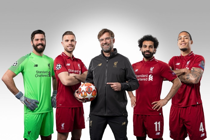 Liverpool F.C. players and Jürgen Klopp with football