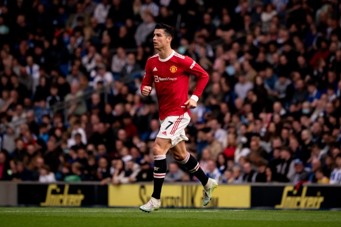 Cristiano Ronaldo from Manchester United running on a field