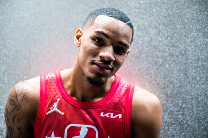 Dejounte Murray wearing a red basketball jersey