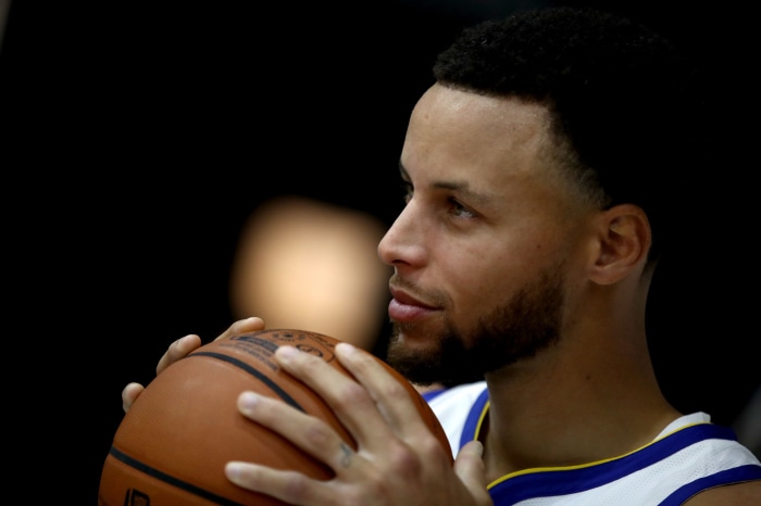 Stephen Curry holding a basketball