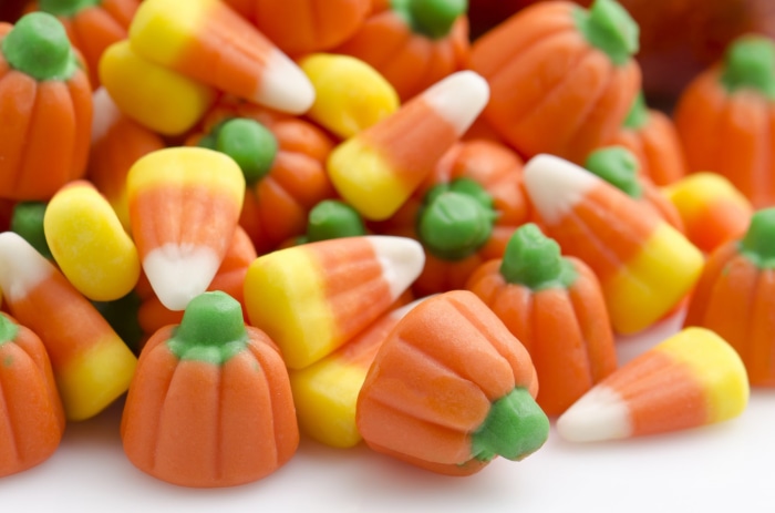 Pile of Halloween Candy Corn and Pumpkins