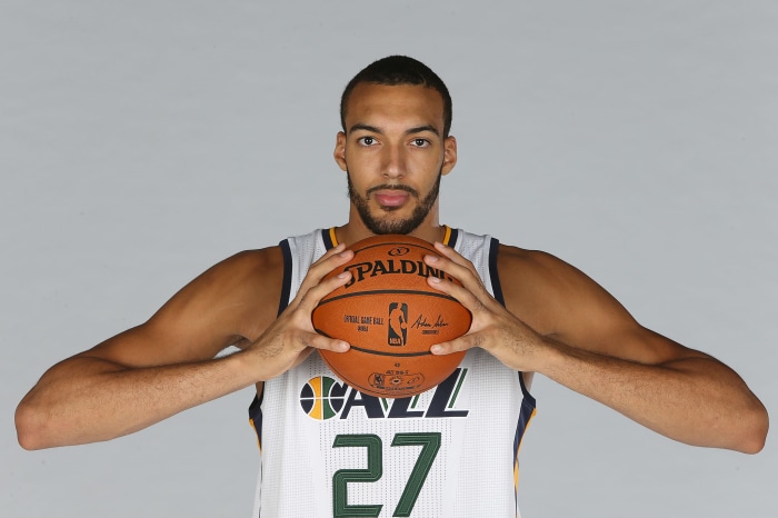 Rudy Gobert of the Utah Jazz holding a Spalding basketball