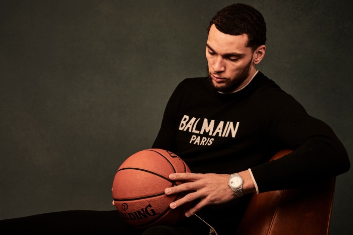 Zach LaVine holding a Spalding basketball