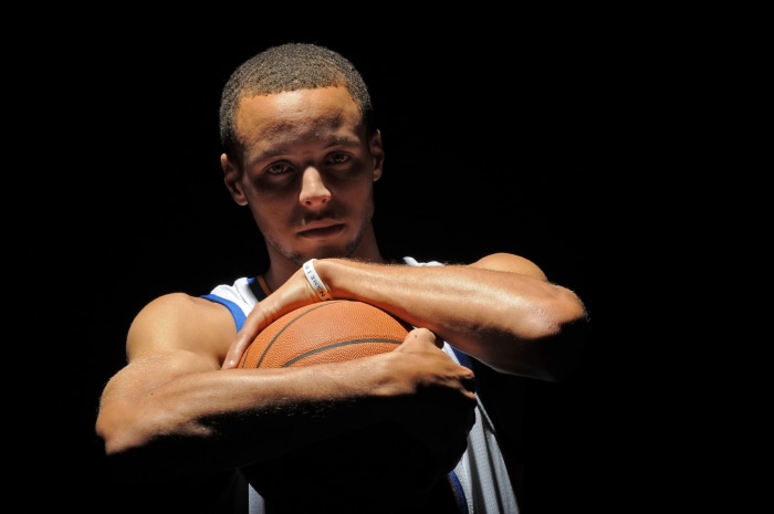 Stephen Curry holding a basketball