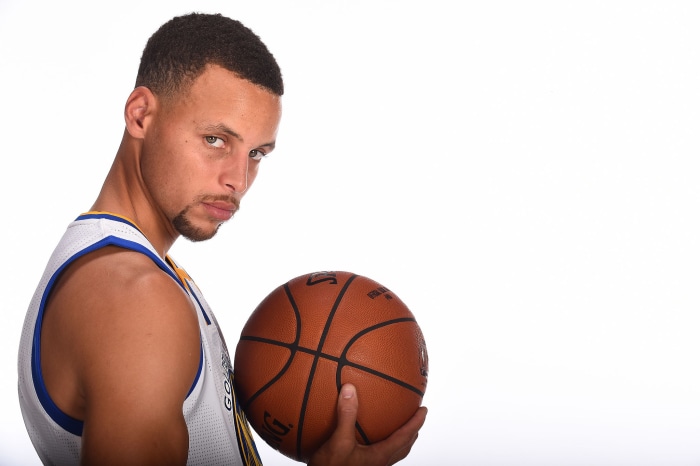 Stephen Curry holding a basketball