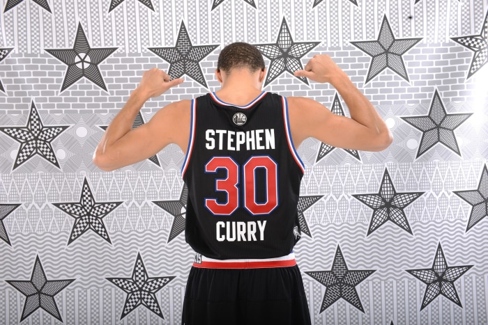 Stephen Curry wearing a basketball jersey