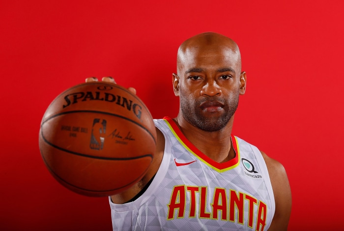 Vince Carter of the Atlanta Hawks holding a Spalding basketball