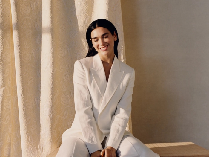 Dua Lipa in a white suit