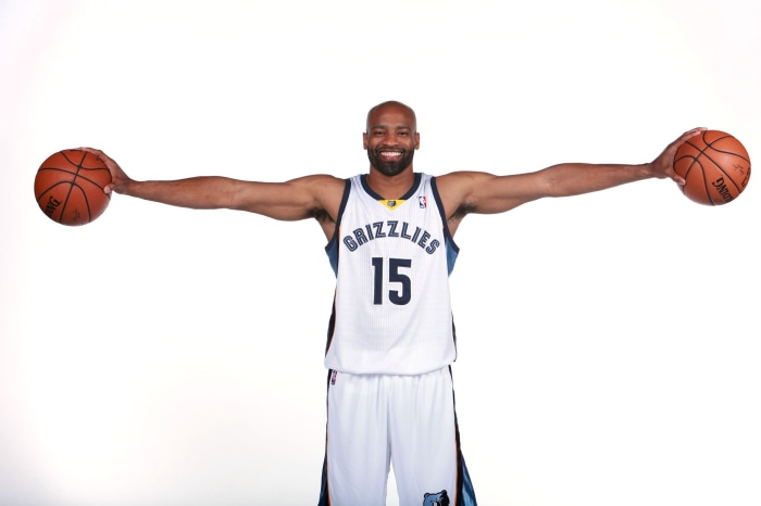Vince Carter of the Memphis Grizzlies holding basketballs