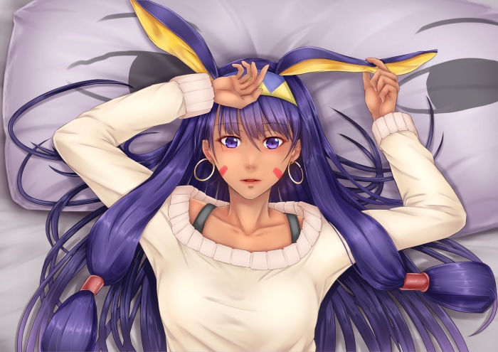 Nitocris from Fate/Grand Order lying on a pillow