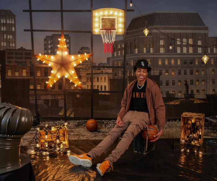 Scottie Barnes on a rooftop with basketball hoop