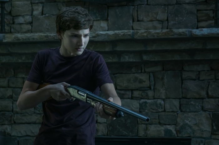 Jonah Byrde from Ozark holding a shotgun