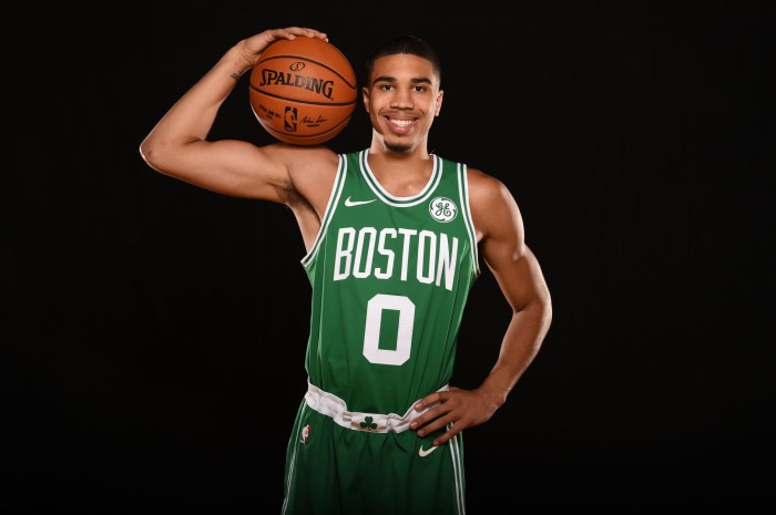 Jayson Tatum from Boston Celtics holding a Spalding basketball