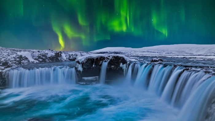 Goðafoss waterfall under Aurora Borealis in Iceland