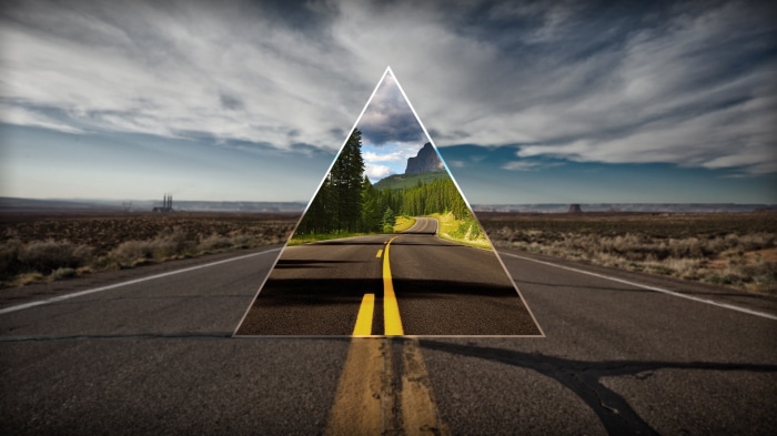 Road through a desert landscape with a triangular overlay of a forest road