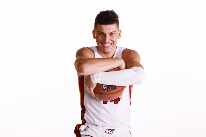 Tyler Herro with a basketball