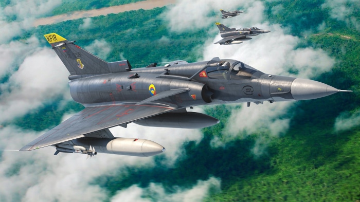 IAI Kfir fighter jets flying over jungle