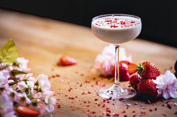 Strawberry cocktail with flowers and strawberries
