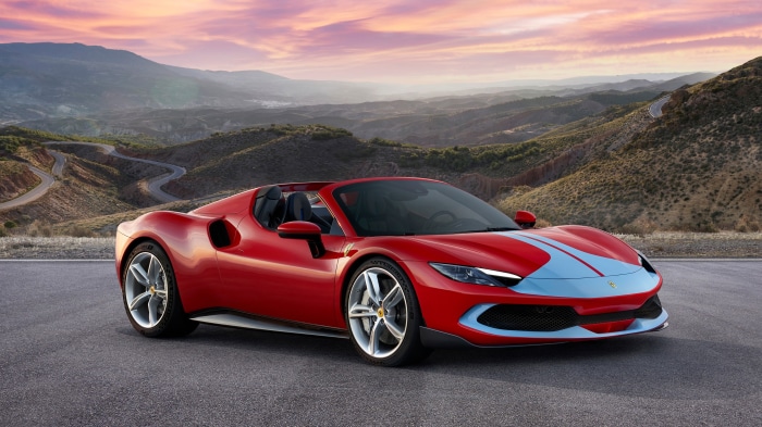Red Ferrari 296 GTS convertible on a mountain road