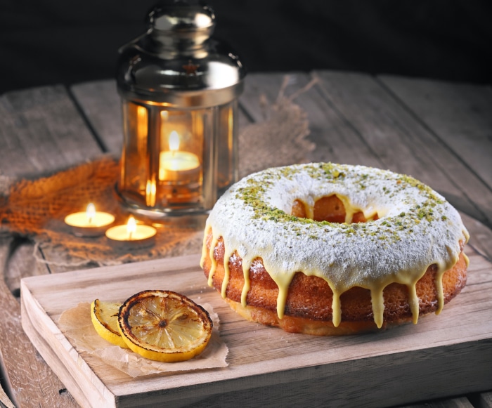 Bundt cake with icing and pistachios 4K