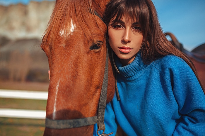 Woman with a brown horse