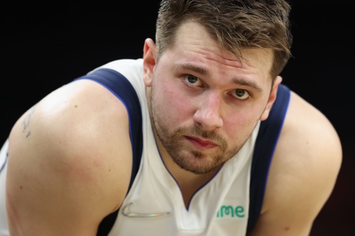 Luka Dončić in a white and blue jersey