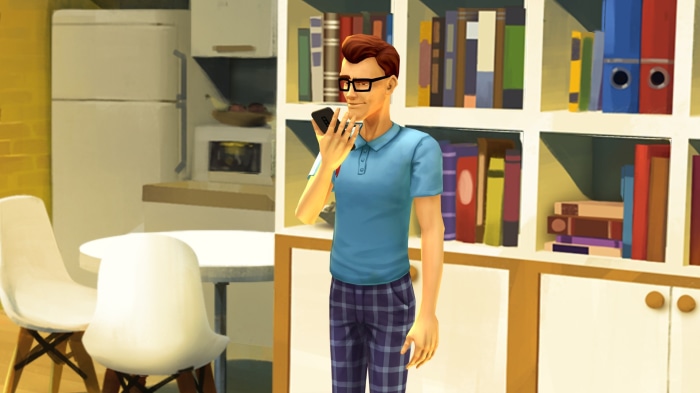Joris holding a phone in a room