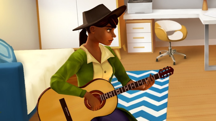 Dana playing guitar in a room