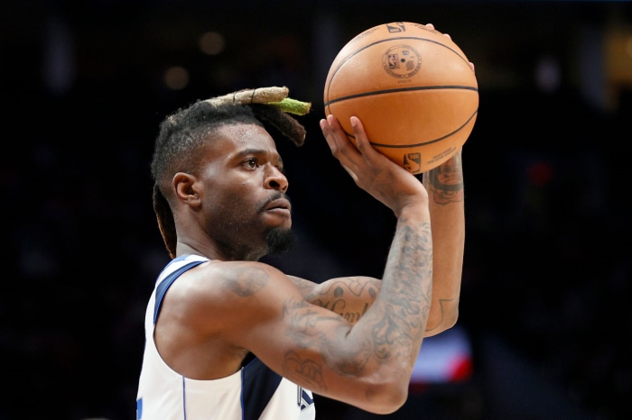 Reggie Bullock shooting a basketball