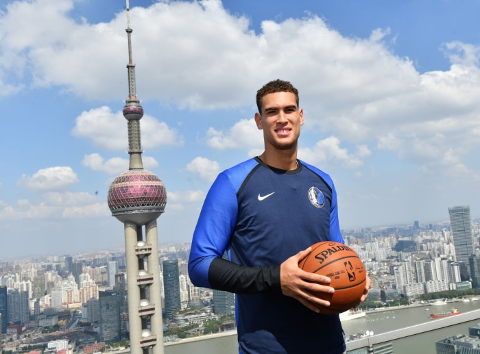 Dwight Powell holding a basketball in Shanghai