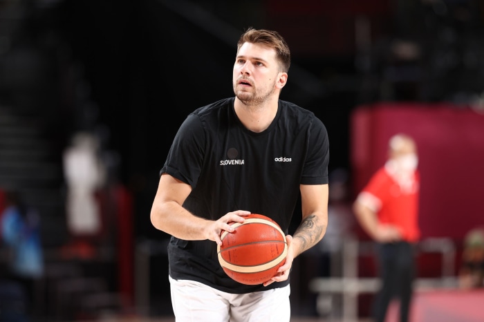 Luka Dončić of Slovenia holding a basketball