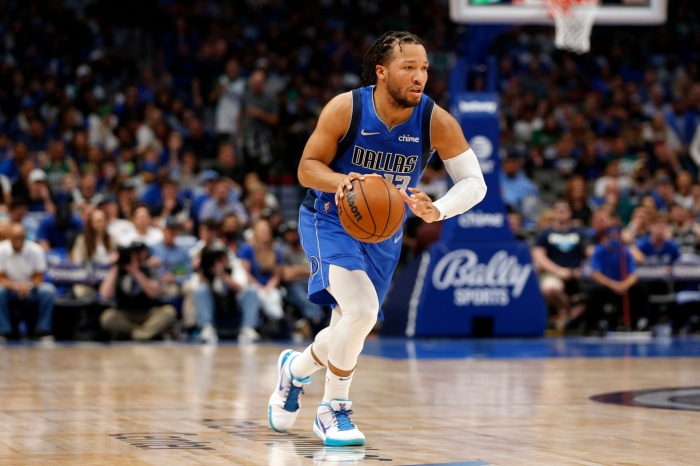 Jalen Brunson of Dallas Mavericks dribbling basketball
