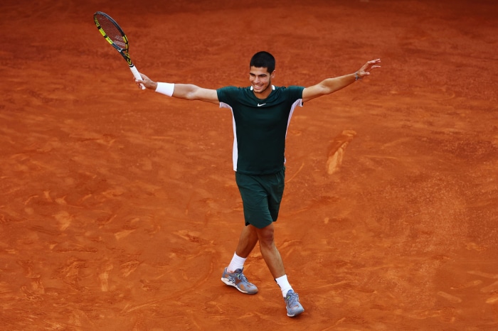 Carlos Alcaraz on a clay tennis court