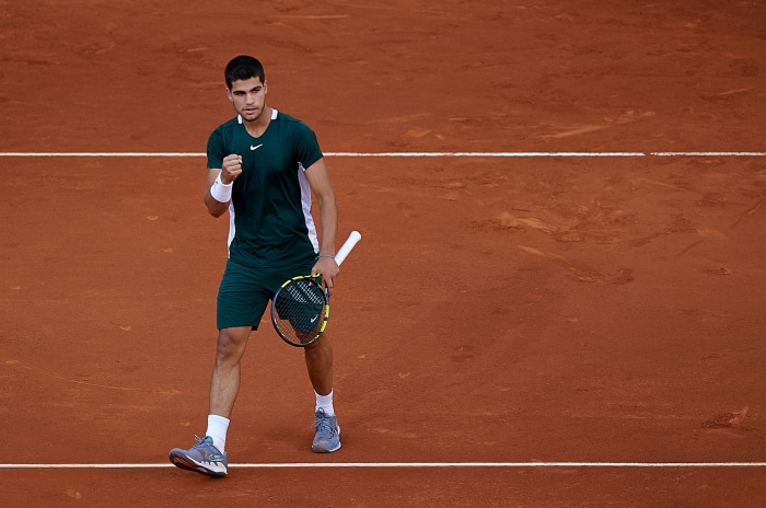 Carlos Alcaraz on a clay tennis court