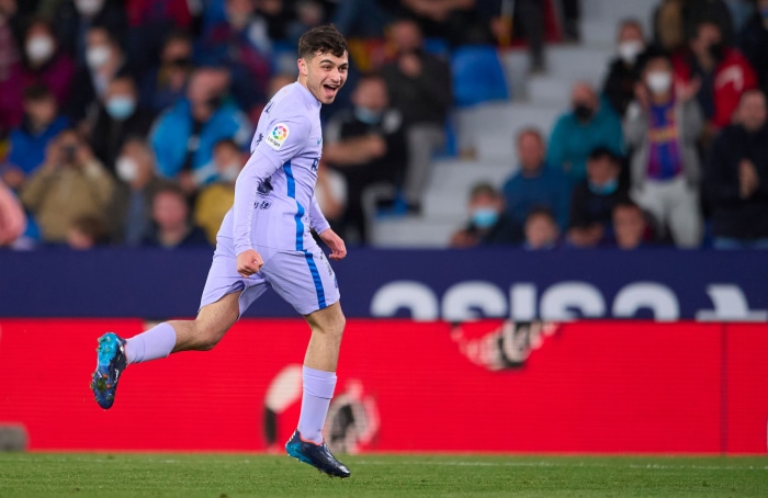 Pedri from Barcelona running on a soccer field