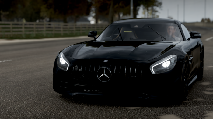 Black Mercedes Benz AMG GT R on a road