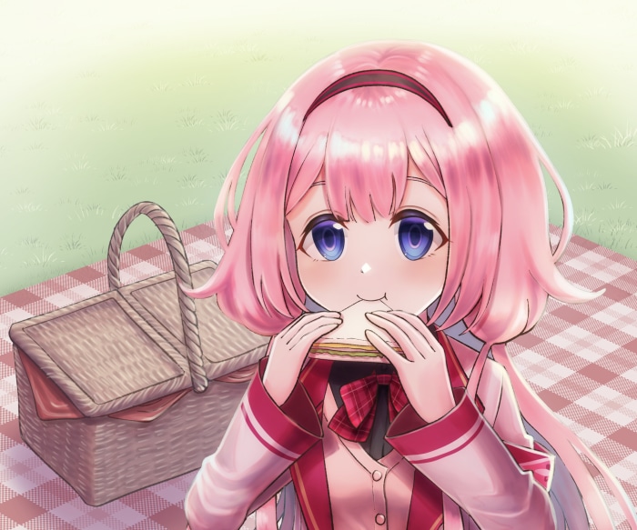 Suo Sango eating a sandwich at a picnic
