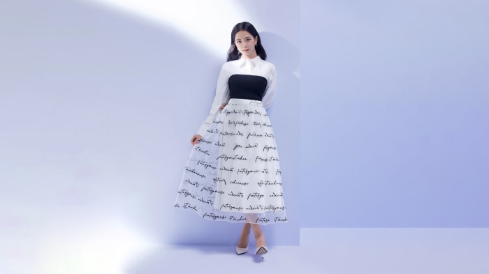Kim Ji-soo in a white shirt and skirt