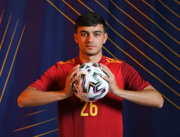Pedri holding a soccer ball