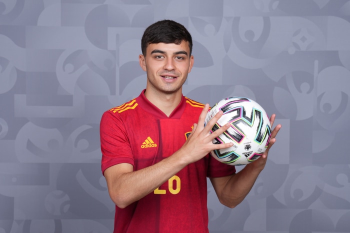 Pedri from Spain holding a soccer ball