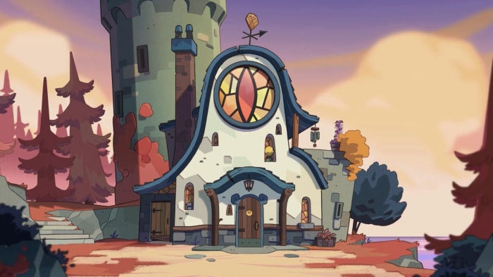 The Owl House building with a large stained glass window