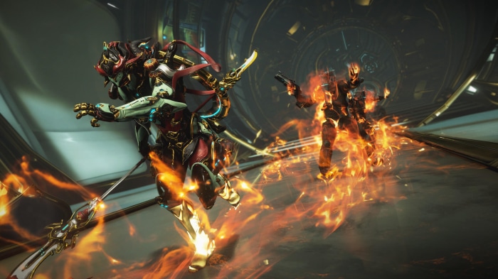 Warframe characters in combat with fire effects